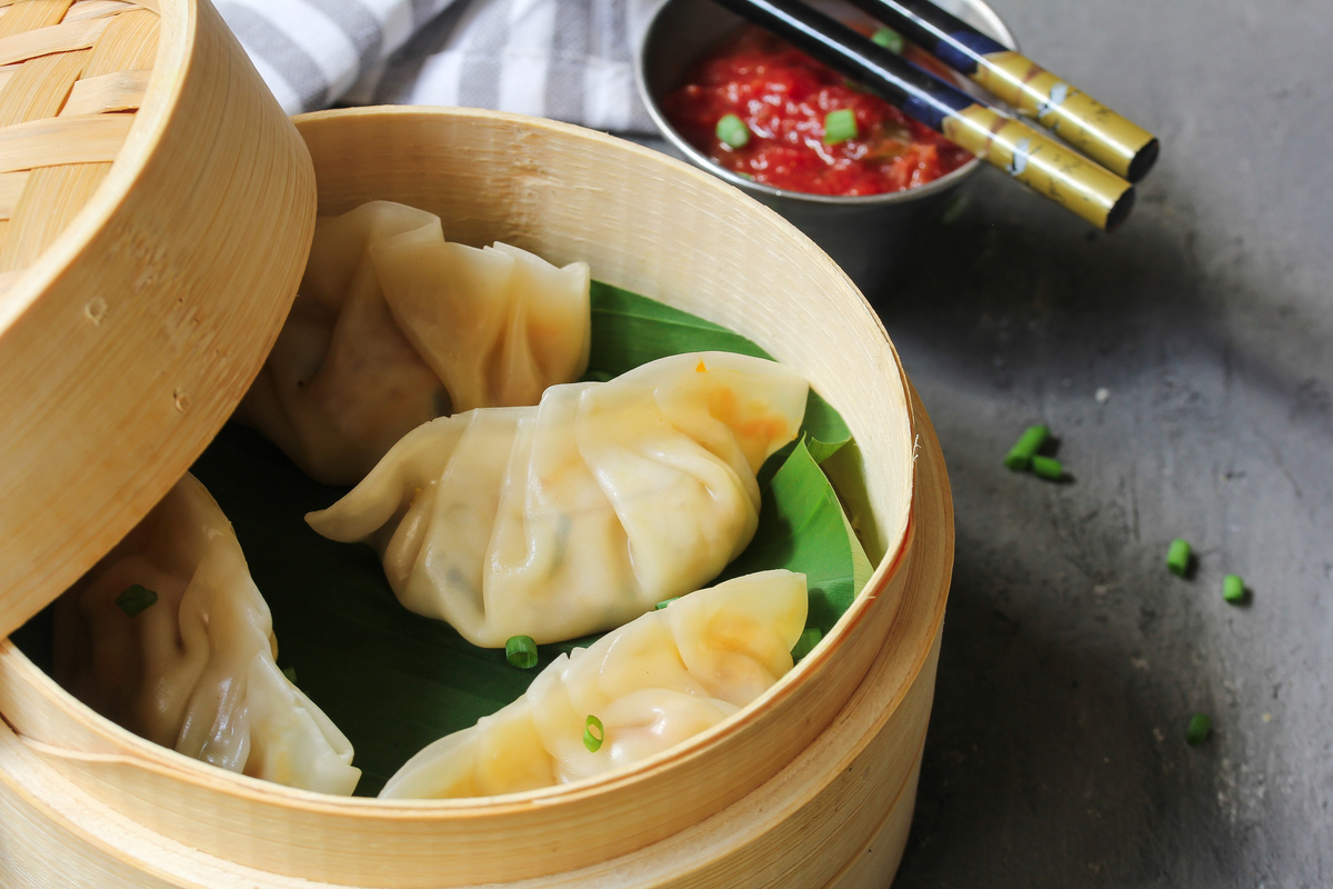 Traditional Nepali Homemade Steamed  Momos in Bamboo Steamer Close up, Selective Focus